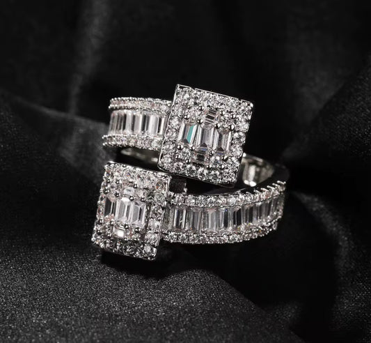 Iced out ring with cubic zirconia baguette stones. Bold, luxe and ready-to-wear sparkle band.