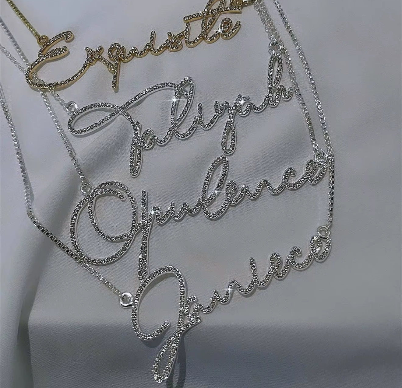 Custom rhinestone name necklaces in silver and gold script 
