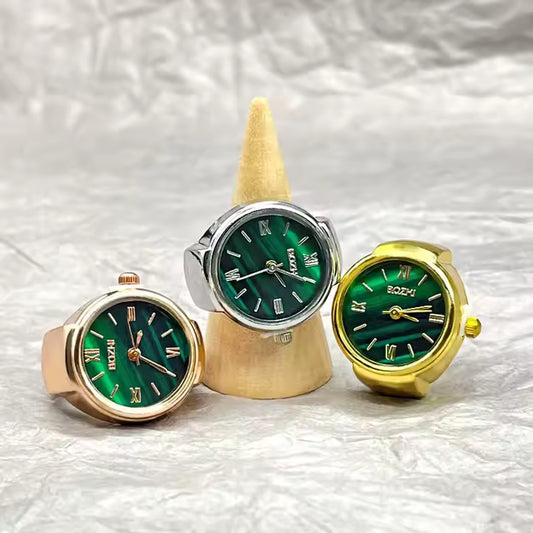 Mini green watch ring with working clock face and adjustable band, trendy fashion accessory for men and women.
